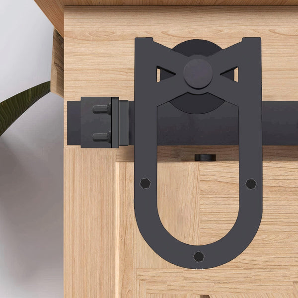 MCK54 Horseshoe Hook Mini Barn Door Hardware Kit. Black horseshoe-shaped hardware on light wood barn door.