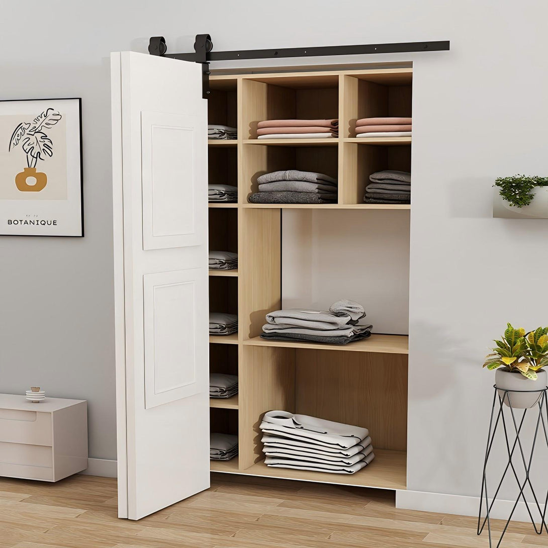 White Bifold Barn Door with Black Barn Door Hardware Kit over a closet filled with clothes, enhancing space